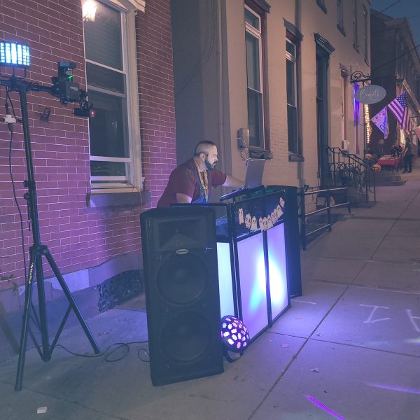 outdoor dj with a spooky themed setup